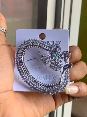 Silver-Toned Flower Brooch Features Intricate Crystal Embellishments