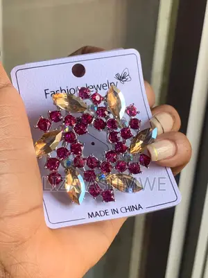 Brooch Features a Wreath Design Adorned With Bright Pink and Clear