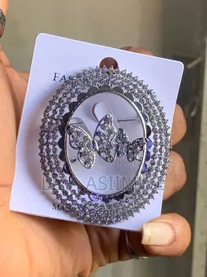 Butterfly Brooch With a Circular Frame Adorned With Rhinestones