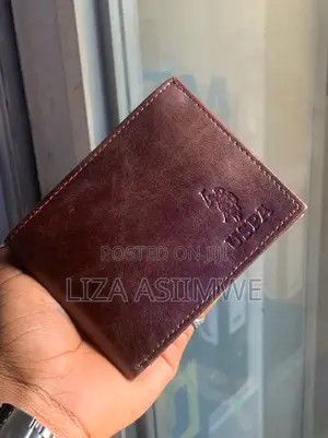 Brown Leather Bifold Wallet Features an Embossed U.S. Polo. (Uspa)