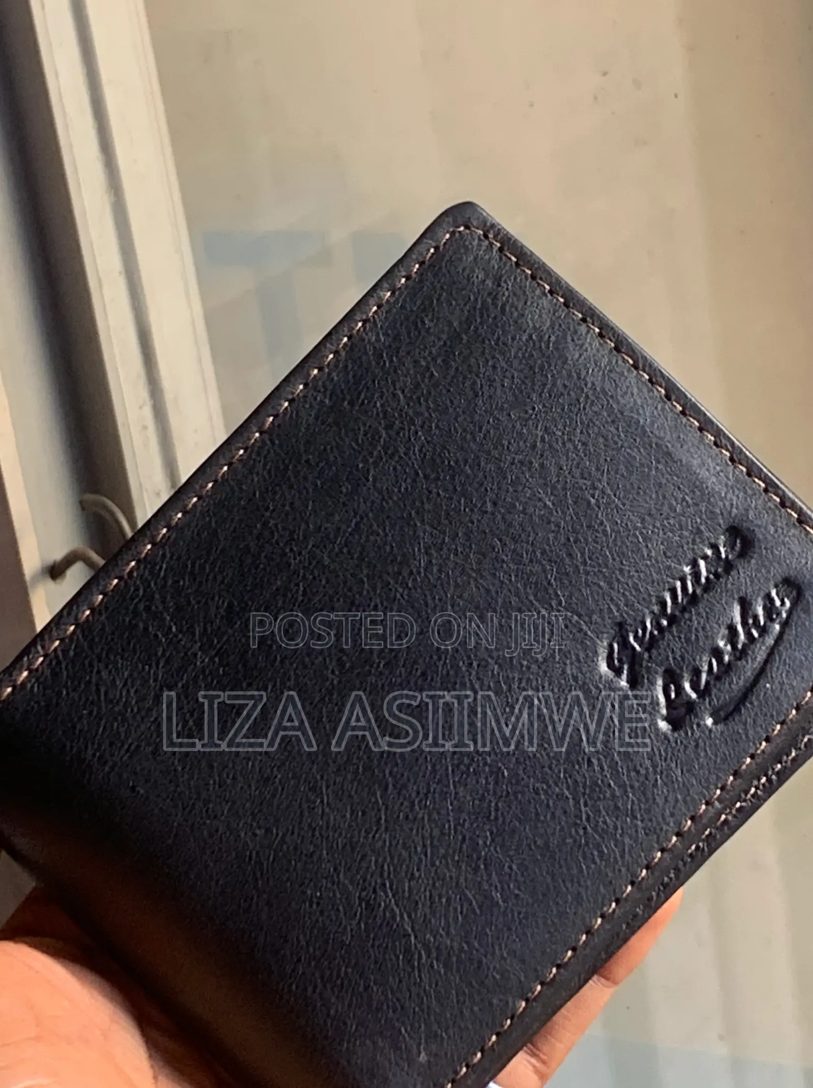 Bifold Wallet Is Crafted From Genuine Black Leather