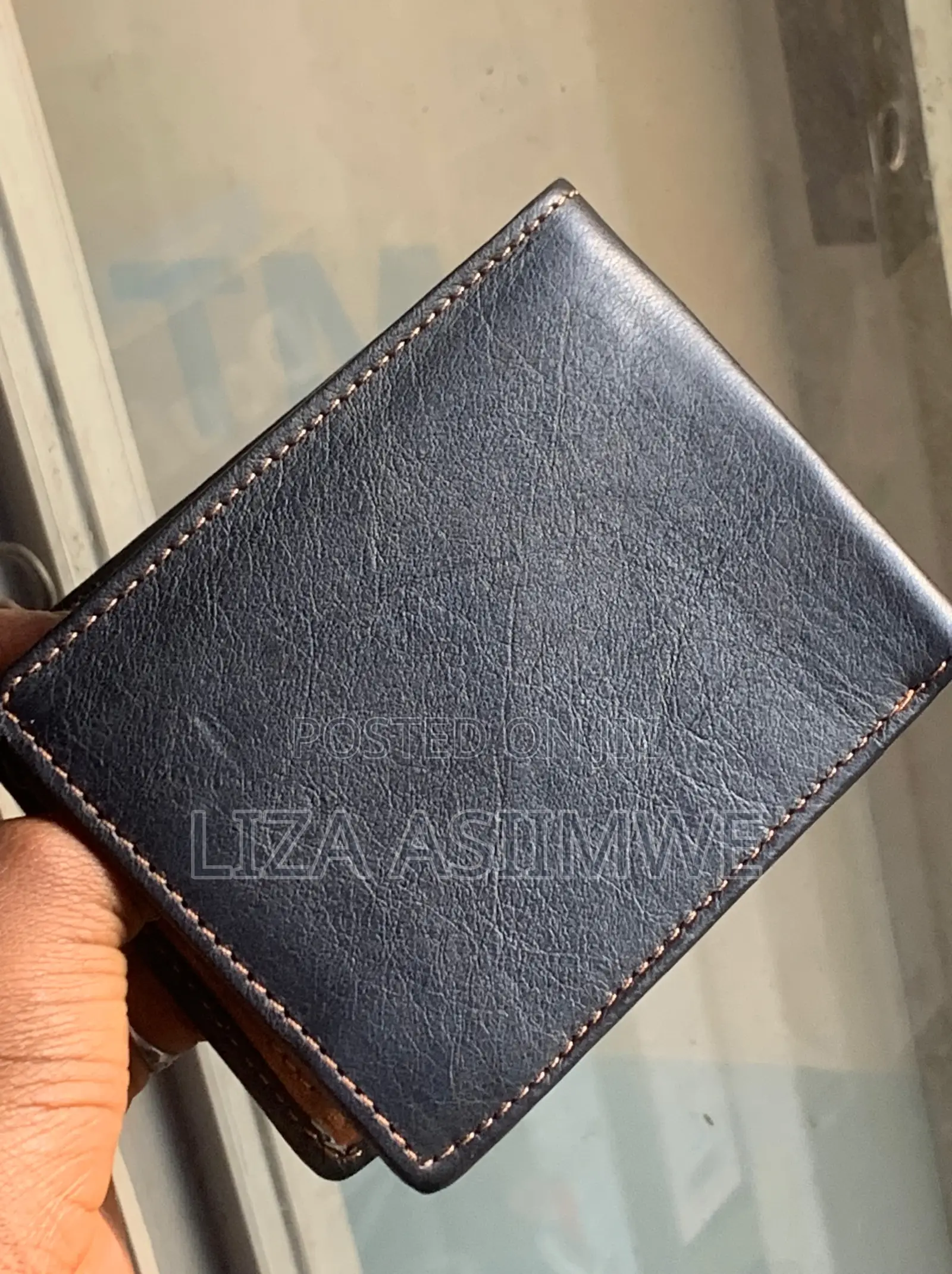Bifold Wallet Is Crafted From Genuine Black Leather