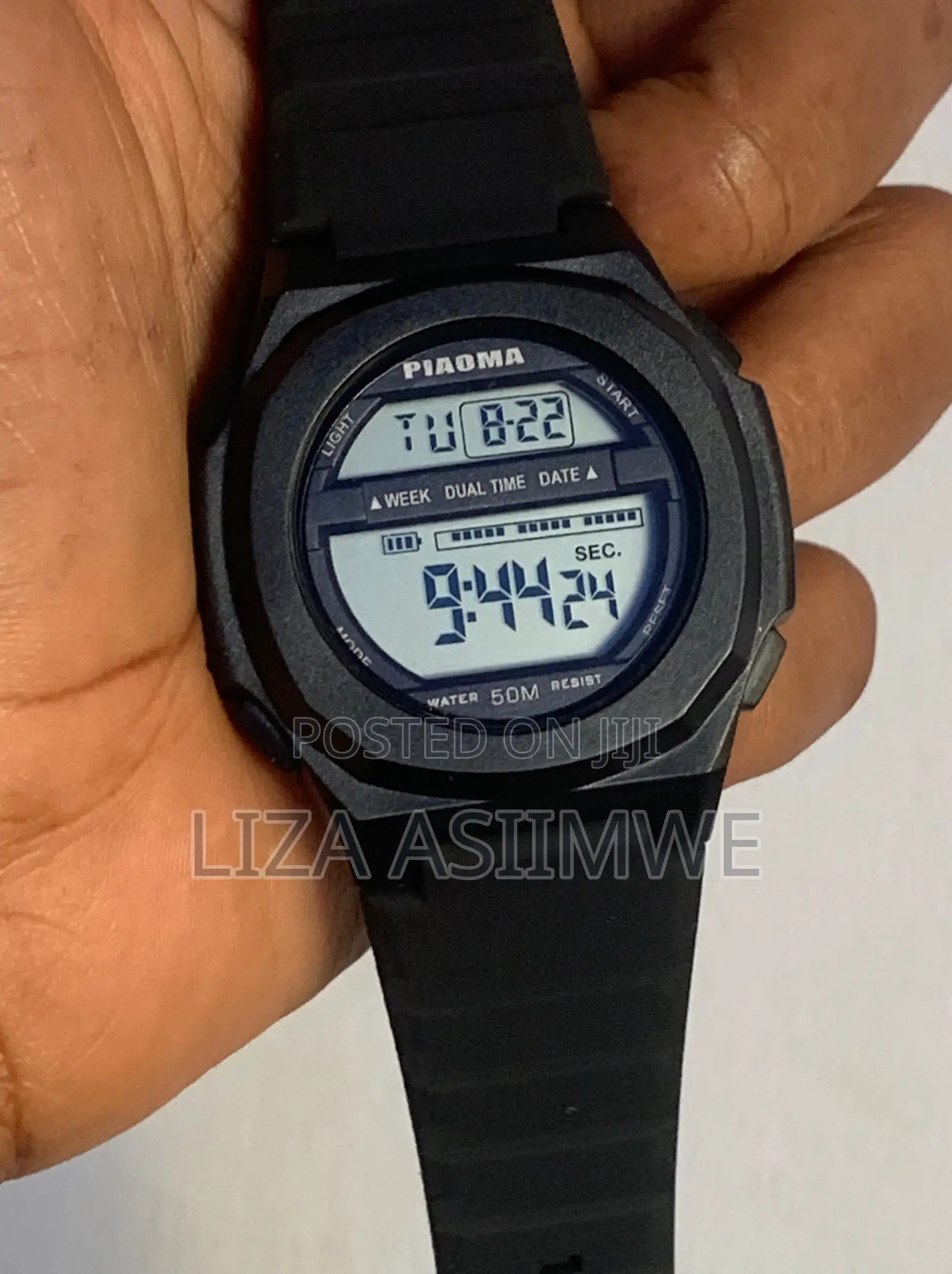 Men’S Digital Watch With a Black Silicone Strap and Is Water Resistant