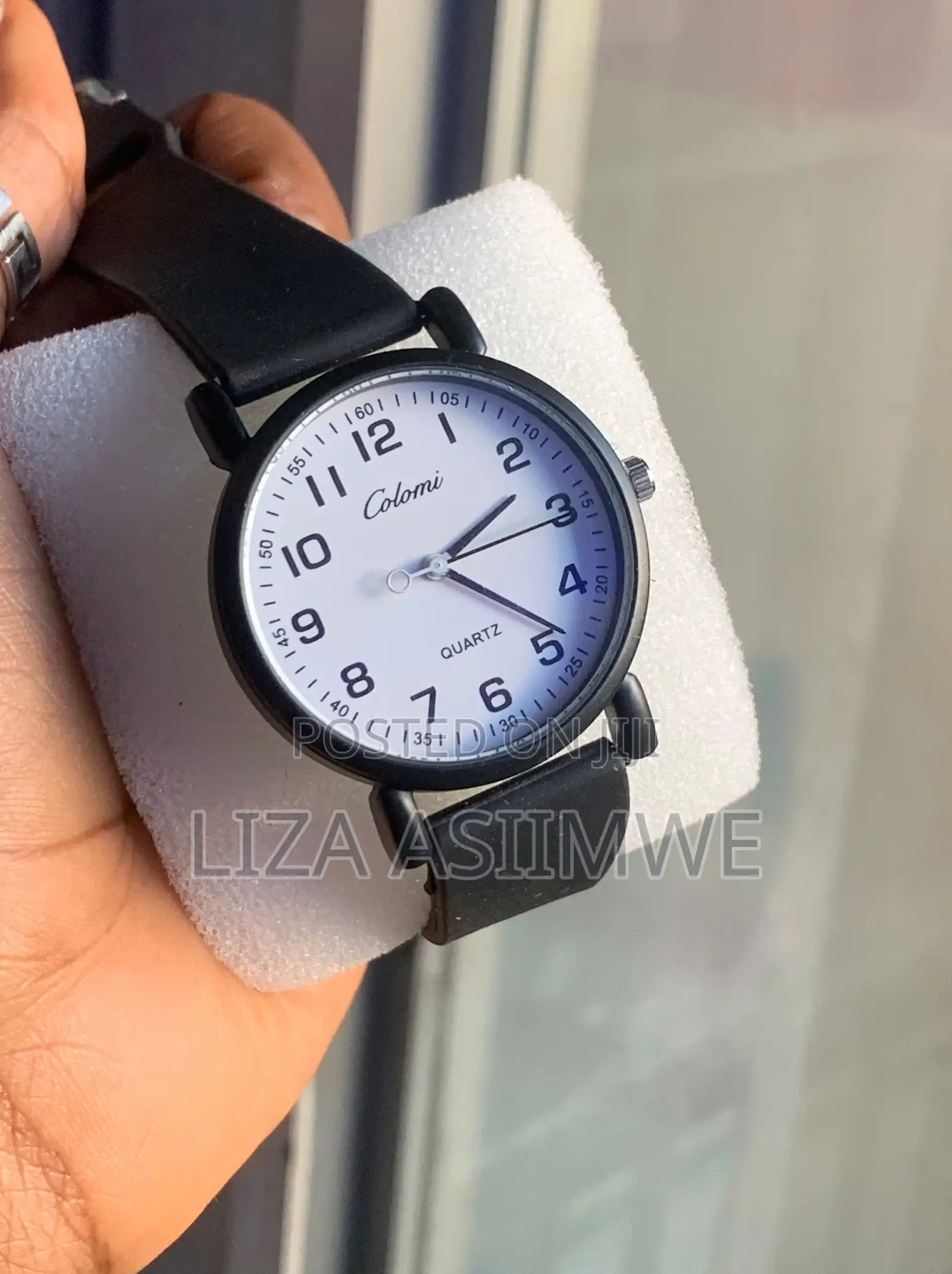 Colomi Quartz Wristwatch With A White Dial With Large Black Numbers