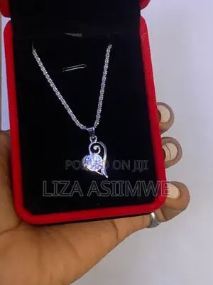 Lady’S Open Style Heart Design With a Brilliant Round Center Gemstone.