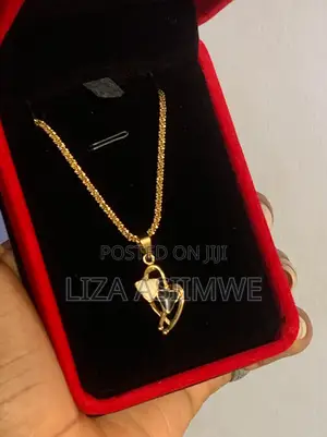 Lady’S Gold-Tone Heart Necklace Features a Distinctive Pendant