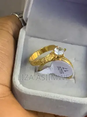 Wedding Ring Set With a Textured Band and a Solitaire Engagement Ring.
