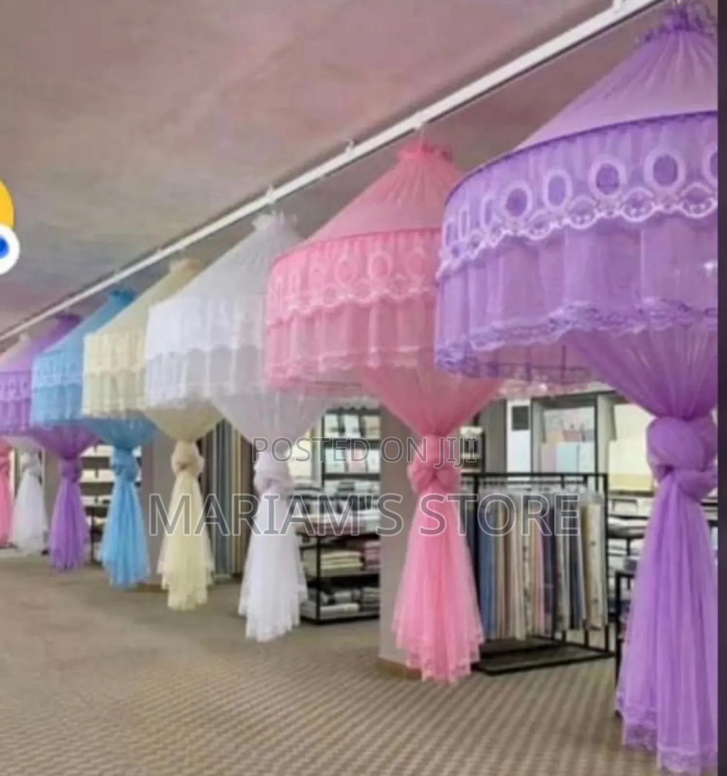 Hanging Mosquito Nets Featuring Decorative Lace Trimming.