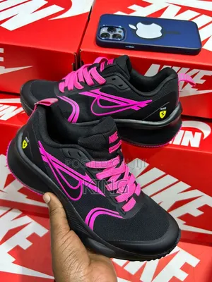 Nike Zoom Running Shoes in Black and Pink.