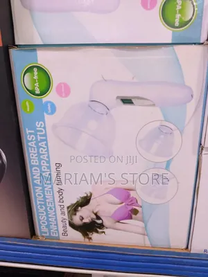 Breast Enhancement Apparatus Package Witha White Handheld Device