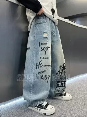 Distressed, Wide-Leg Light Wash Denim Jeans