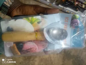 Ice Cream Scoop Features a Wooden Handle.