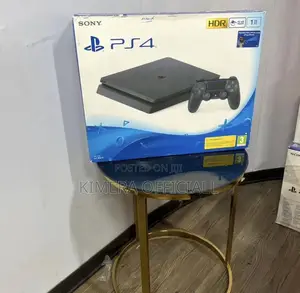 Used Playstation 4 Slim in a Box. Almost New. With 2 Pads and 12 Games