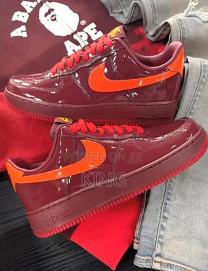 Nike Air Force 1 Low Sneakers in a Glossy 'Dark Team Red' Patent