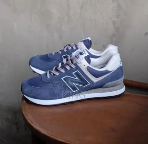 New Balance 574 Sneakers in a Navy and Grey Suede