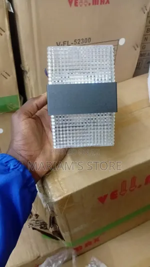 Led Wall Lamp a Clear, Grid-Patterned Glass Shade.