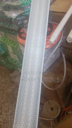 Led Batten Light Fixture With a Honeycomb or Mesh-Patterned Diffuser.