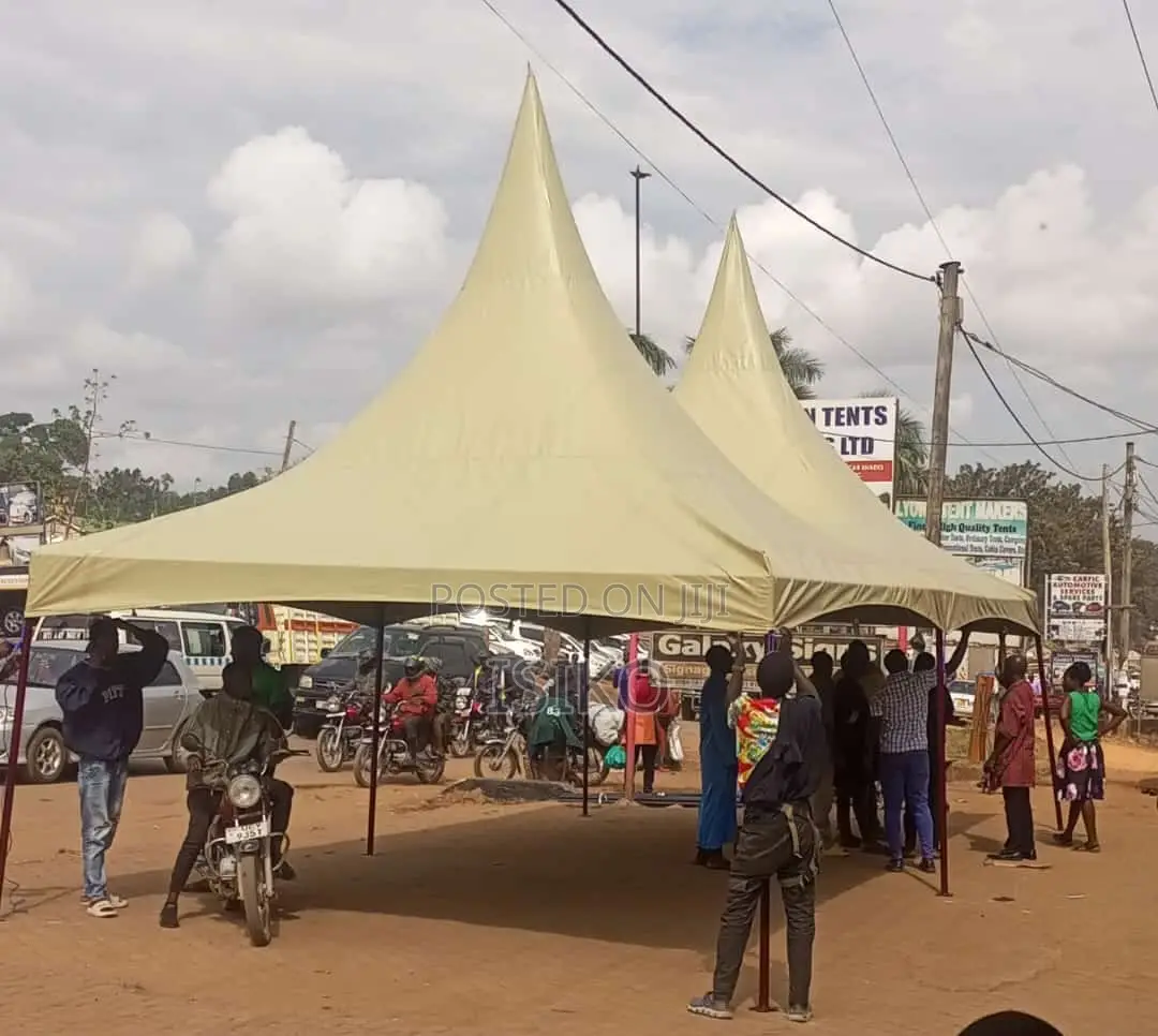 A Beige Colored Double Peaked Tent