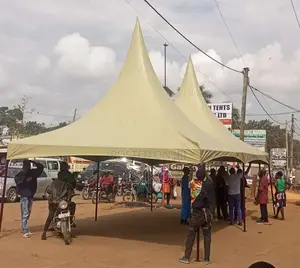 A Beige Colored Double Peaked Tent