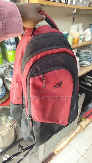 Uk Used Odyssia Brand Backpack, Red And Black In Colour.