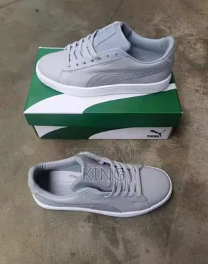 Grey Puma Suede Classic Shoes With a White Sole