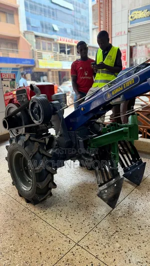Walking Farm Tractor With Water Cooled Engine and Ox Plough