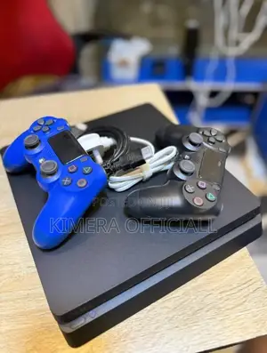 Chipped Ps4 Slim With 2 Controllers and 12 Games. Fairly New Condition