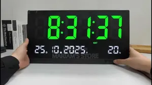 Digital Wall Clock With a Large Green Led Display and Temperature.