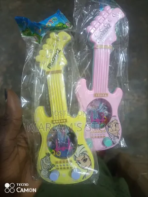 Plastic Musical Toy Guitars Featuring Characters From Frozen 2.