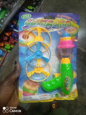 Shoot Game Toy Set a Bright Green Launching and Spinning Tops.