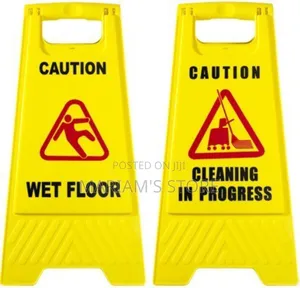 Yellow Plastic Signs Are Designed To Warn People Of Slippery Floors