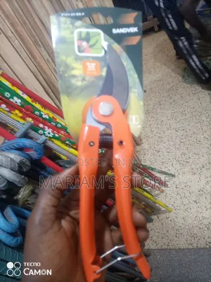 Pruning Shears With Green Ergonomic Handles.