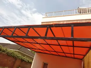 Wall-Mounted Pergola With a Shade Sail Canopy