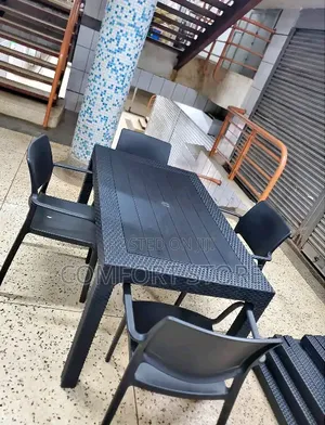 Large Rectangular Black Plastic Table With 4 Black Chairs