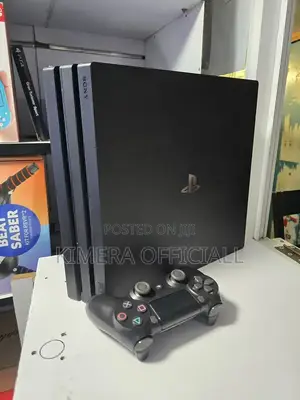 Ps4 Pro Very Neat. Chipped With 30 Games and Two Controllers Very Nice