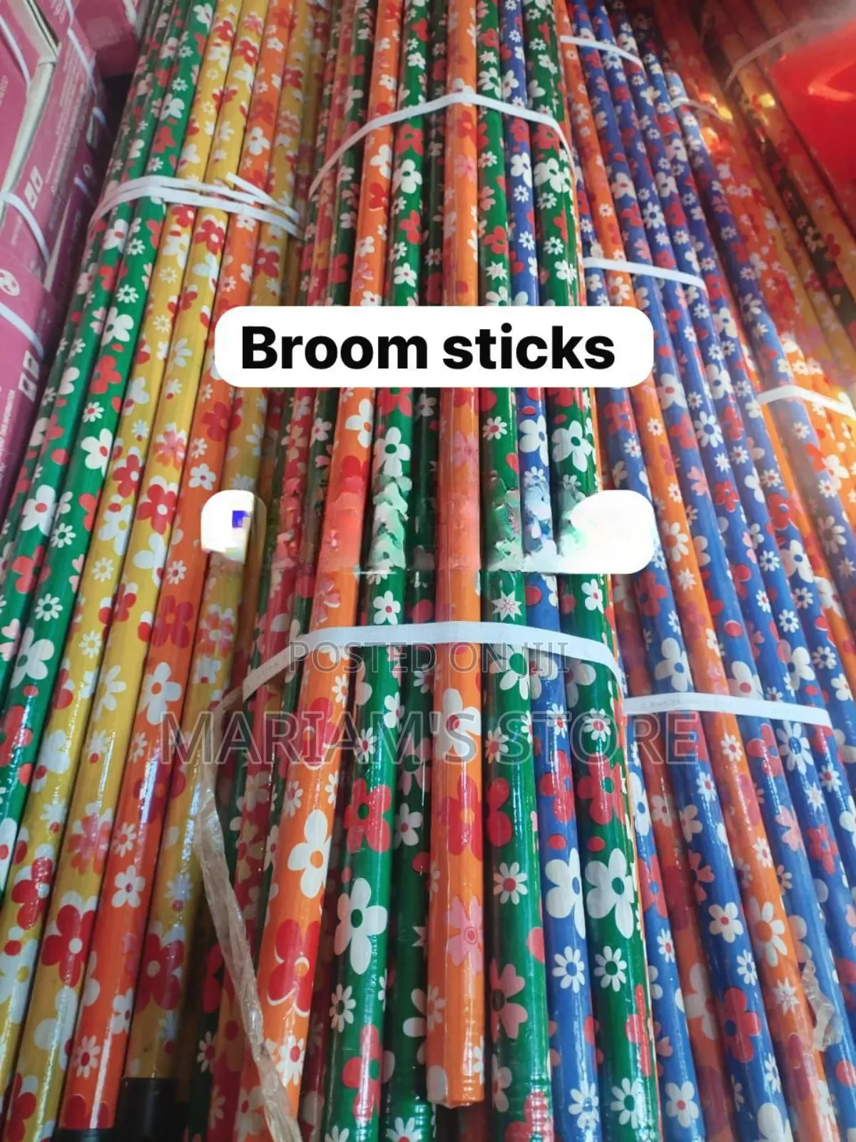 Wooden Broom Handles, Often Featuring Vibrant Floral Patterns.