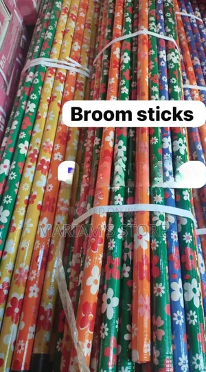 Wooden Broom Handles, Often Featuring Vibrant Floral Patterns.