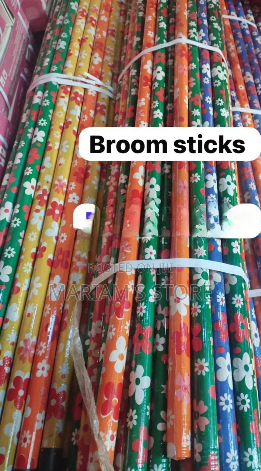 Wooden Broom Handles, Often Featuring Vibrant Floral Patterns.