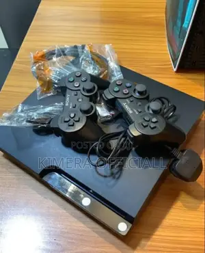 Sony Ps3 Slim With 15 Games and 2 Controllers. Very Neat Almost New