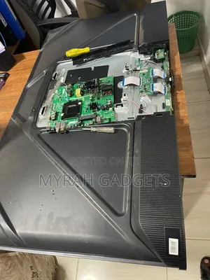 Dismantled Television Layout on a Workbench