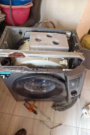 Front-Loading Washing Machine Undergoing Internal Repairs