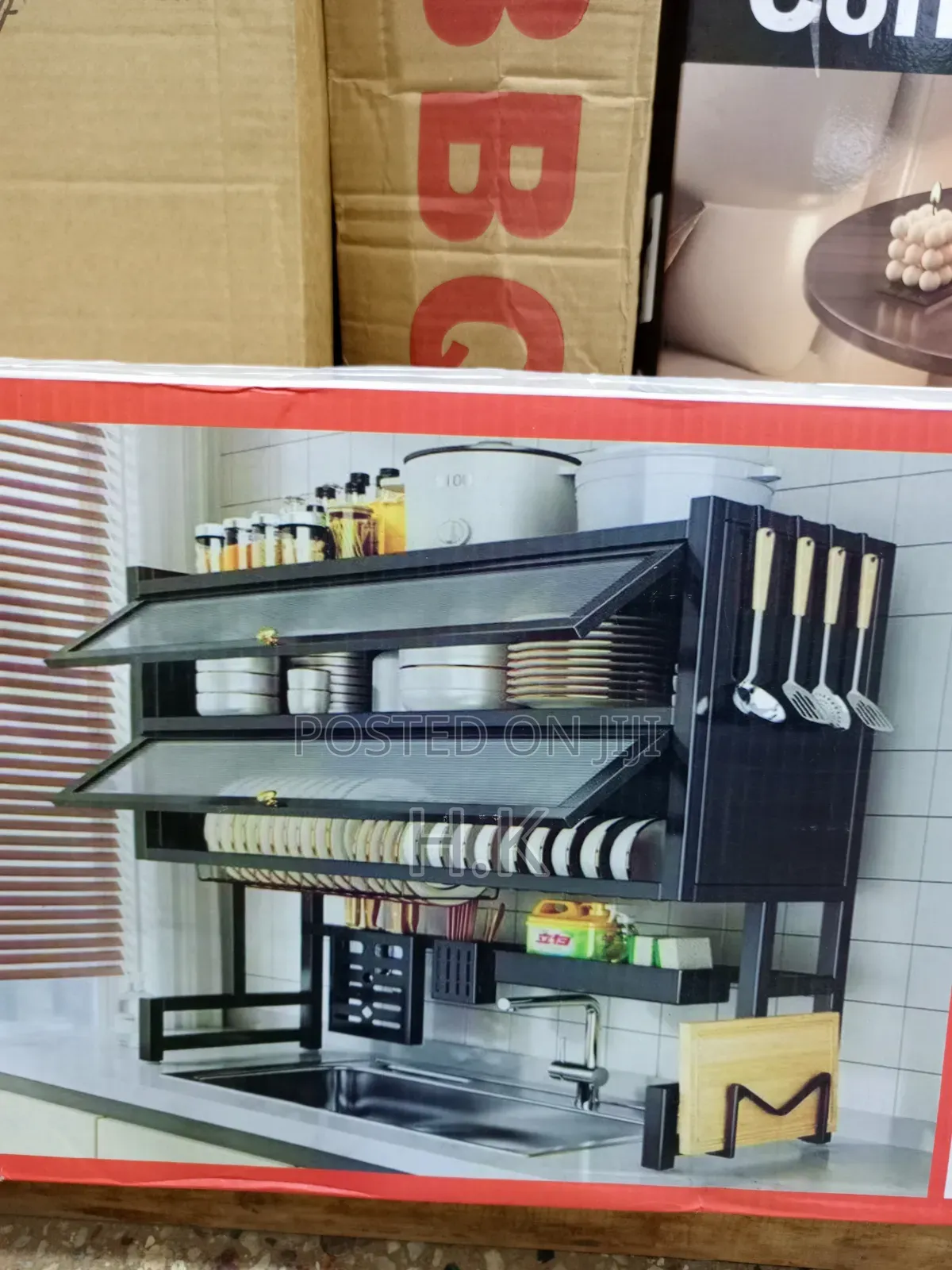 Black Double-Layer Dish Rack Features Flip-Up Cabinet Doors