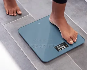 Electronic Digital Body Weighing Scale With A Tempered Glass Top.