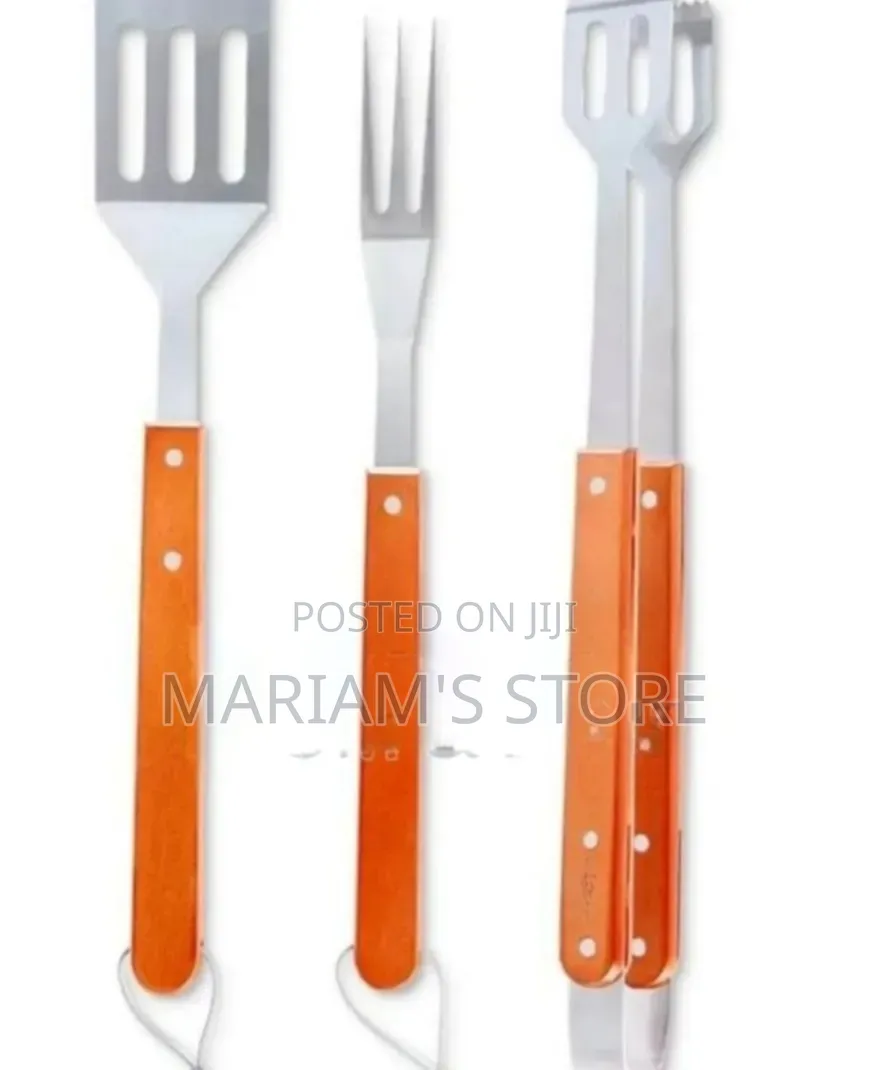 Three-Piece Stainless Steel Barbecue Set Distinctive Orange Handles.