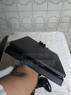 Genuine Sony PS4 Slim (Superb Condition) With 12 Games 2 Controllers