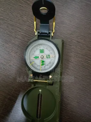 Military-Style Green Lensatic Compass Used for Navigation,.