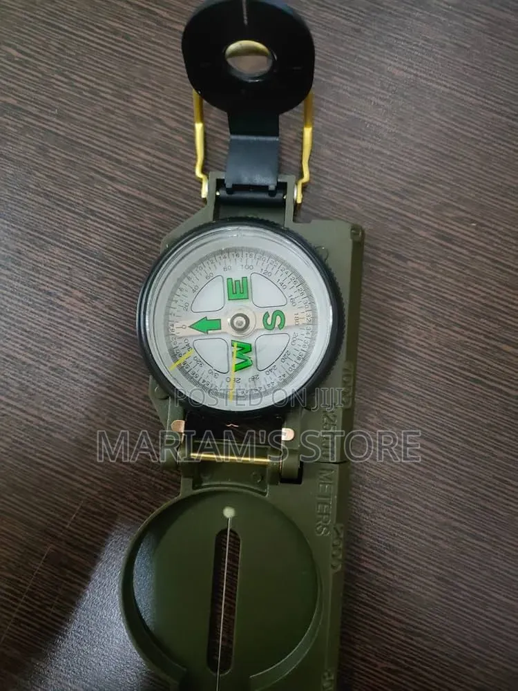 Military-Style Green Lensatic Compass Used for Navigation,.