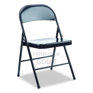 Black Metal Folding Chair Features a Padded Vinyl Seat and Backrest