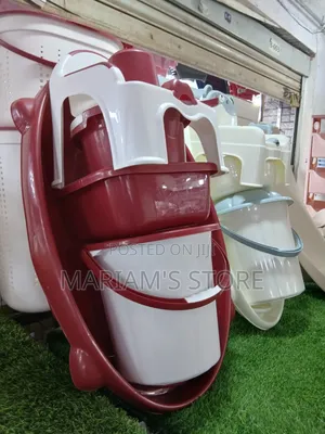 Red and White Plastic Baby Bath Set Includes a Tub, Basin, and Potty.