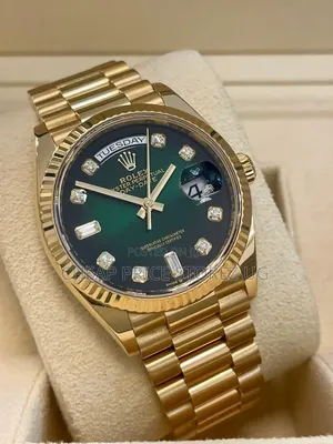 This Is 18-Karat Yellow Gold Rolex Day-Date 36 Featuring a Green
